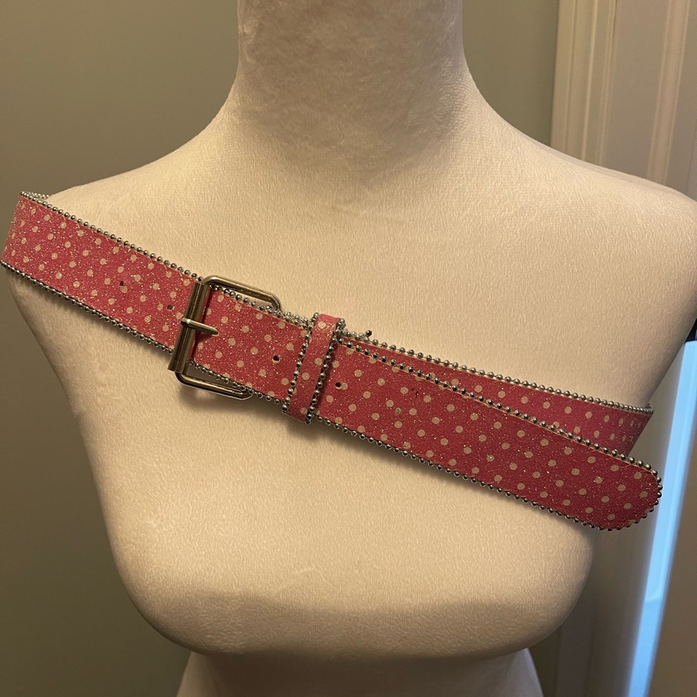 Woman’s pink polka dot sparkly belt